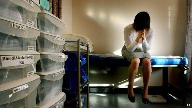 Model posing in a medical room