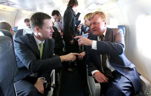 Liberal Democrat Party leader Nick Clegg (left) and former Leader Charles Kennedy chatting during a flight to Glasgow