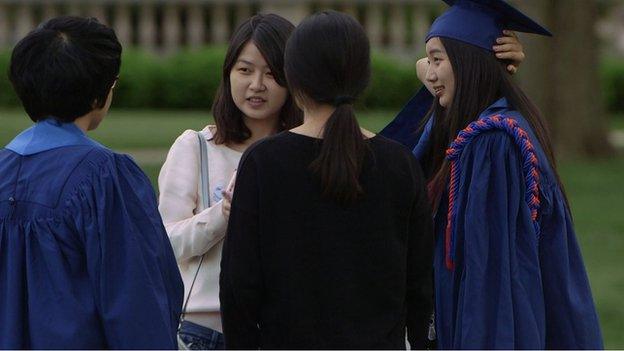 Group of Chinese students standing and talking at UIUC