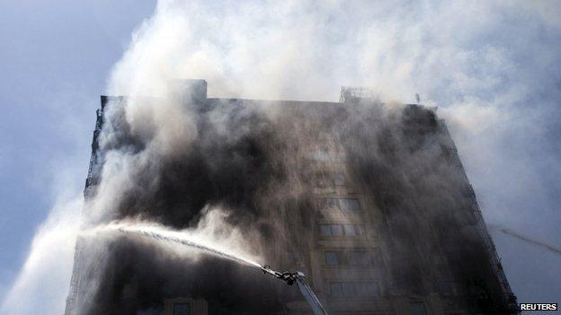 Smoke rises from a multi-storey residential building on fire in Baku, Azerbaijan