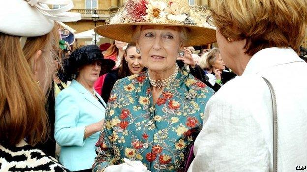 Princess Alexandra greets guests during a garden party in honour of the centenary of the Women's Institute at Buckingham Palace in London