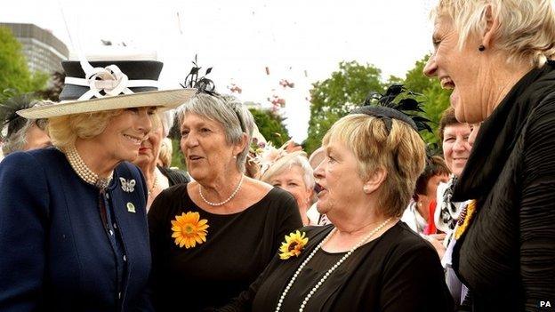 The Duchess of Cornwall talks with the Calendar Girls (left to right) Angela Knowles, Ros Fawcett and Patricia Stewart