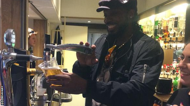 Chris Gayle puling a pint