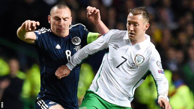 Scotland captain Scott Brown challenges Aiden McGeady