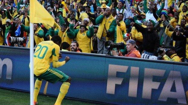 South Africa's defender Bongani Khumalo celebrates with supporters after scoring the opening goal during the Group A first round 2010 World Cup football match against France