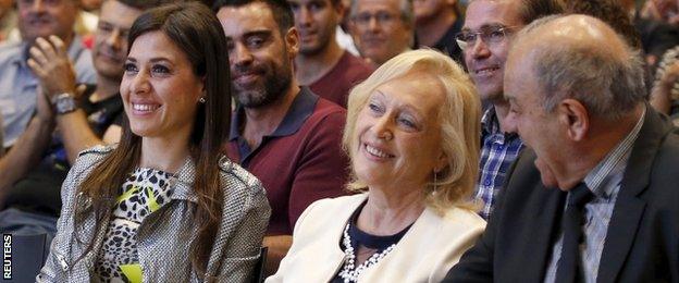 Xavi's wife (left) and his parents