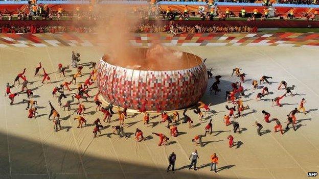 Performers dance around a representation of the calabash cooking pot which inspired the design of Soccer City Stadium, during the Opening Ceremony ahead of the 2010 FIFA World Cup South Africa Group A match between South Africa and Mexico at Soccer City Stadium on June 11, 2010 in Johannesburg, South Africa