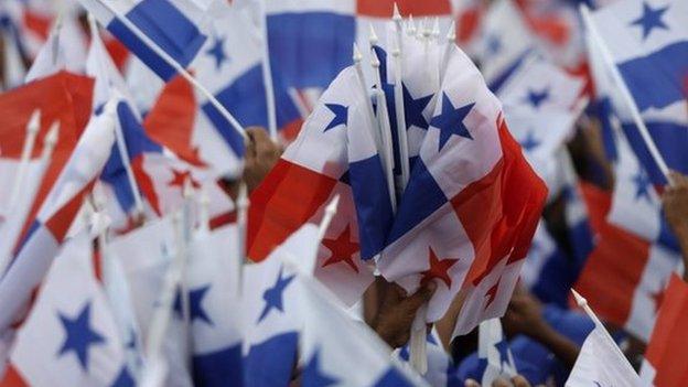 Supporters wave Panama flags at campaign rally in Panama City on 26 April, 2014