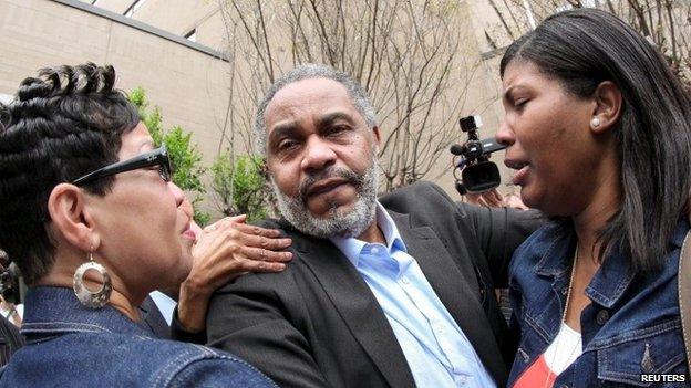 Death row inmate Anthony Ray Hinton is greeted by family outside the Jefferson County Jail