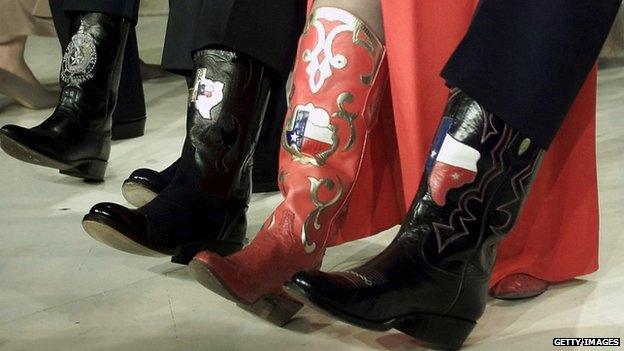 lineup of Texas boots belonging to (L-R) US President-elect George W. Bush, Rick Perry, Governor of Texas; Senator Kay Bailey Hutchinson and Senator Phil Graham both of Texas on stage at the Texas State Black Tie and Boots Ball at the Marriott Wardman Park 19 January, 2001, in Washington, DC