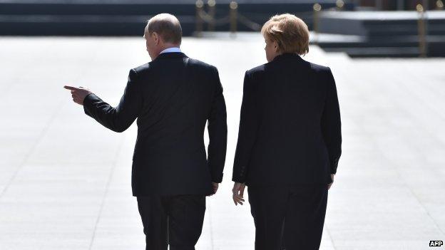 Vladimir Putin and Angela Merkel