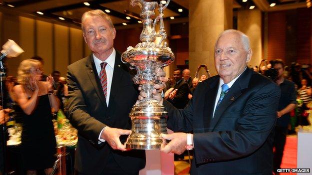 John Bertrand and Alan Bond hold up the America's Cup, 2013