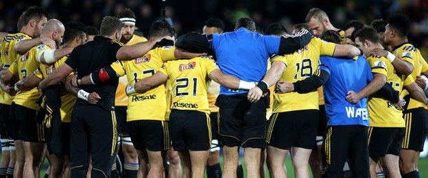 Hurricanes players hold a minute's silence before their game on Friday