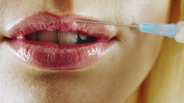 Woman's lips being injected