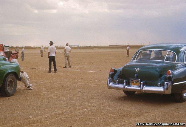 Cars near the baseball field