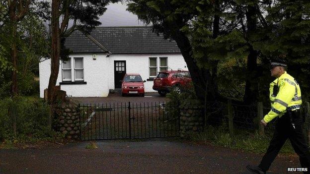 Policeman outside Charles Kennedy's home