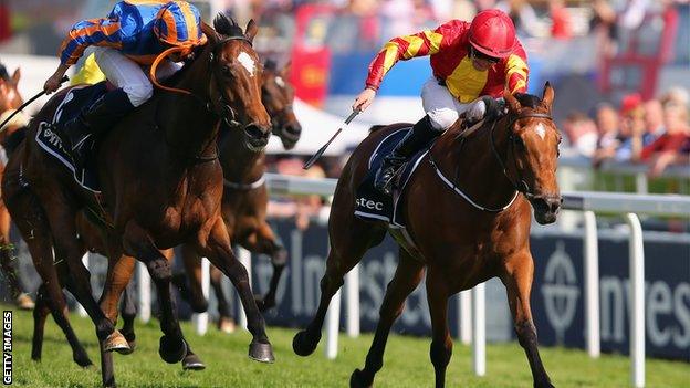 Qualify (right) wins the Oaks