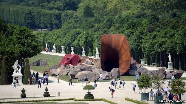 "Dirty Corner", a Cor-Ten steel, earth and mixed media monumental artwork by British contemporary artist of Indian origin Anish Kapoor, is displayed in the gardens of the Chateau de Versailles, in Versailles on June 5, 2015