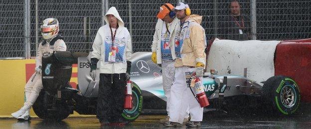 Hamilton calmly signalled to the Canadian crowd who continued to brave the weather.