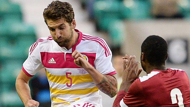 Charlie Mulgrew in action against Qatar