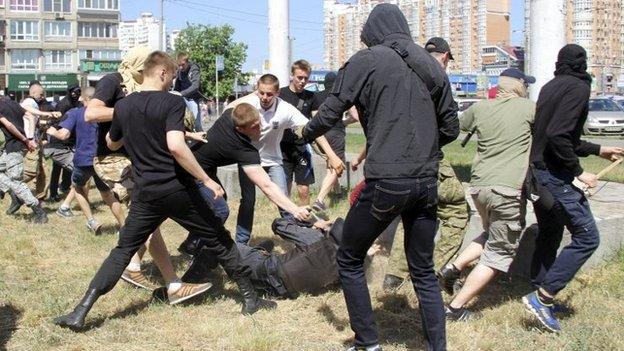 Anti-gay protesters attack a policeman in Kiev, Ukraine. Photo: 6 June 2015