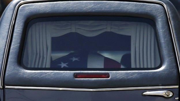 A hearse carries a casket containing the remains of Beau Biden (06 June 2015)