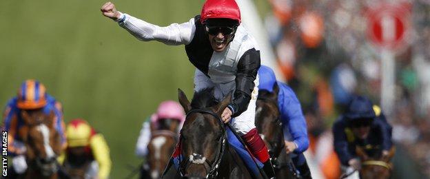 Frankie Dettori rides Golden Horn to victory in the Derby