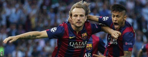 Ivan Rakitic celebrates his goal with Neymar