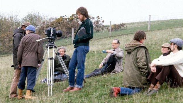 Alan Whicker with a film crew