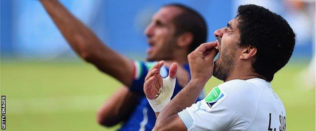 Luis Suarez and Italy defender Giorgio Chiellini