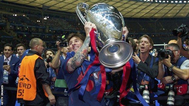 Barcelona's Lionel Messi lifts the Champions League trophy in Berlin