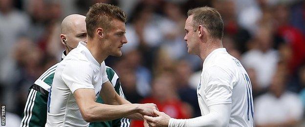 Jamie Vardy (left) came on for Wayne Rooney to make his England debut