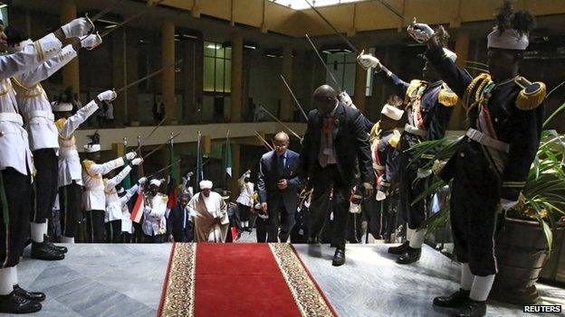 Sudan's President Omar al-Bashir (centre left) arrives to take his oath during his presidential inauguration ceremony (02 June 2015)