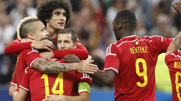 Belgium players celebrate after scoring the fourth goal against France