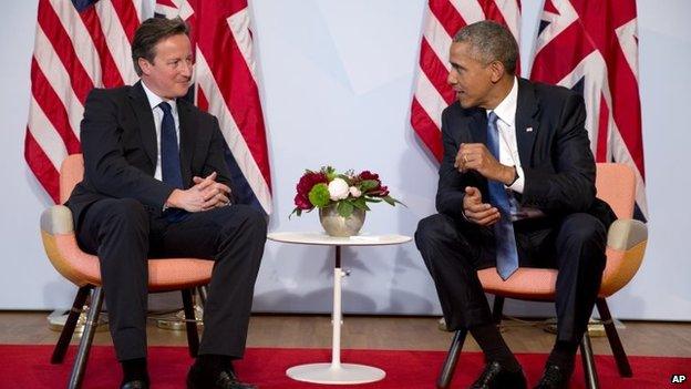 President Barack Obama and British Prime Minister David Cameron talking at G7 summit