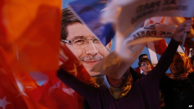 A poster of Turkey's Prime Minister and leader of the Justice and Development Party (AKP) Ahmet Davutoglu