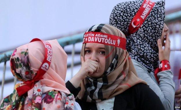 Supporters of Turkey"s ruling Justice and Development Party (AKP) react while waiting for Turkish Prime Minister Ahmet Davutoglu (not pictured) in front of the party"s headquarter in Ankara, Turkey 07 June 2015.