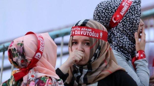 Supporters of Turkey"s ruling Justice and Development Party (AKP) react while waiting for Turkish Prime Minister Ahmet Davutoglu (not pictured) in front of the party"s headquarter in Ankara, Turkey 07 June 2015.