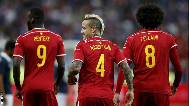 Belgium's Christian Benteke, Radja Nainggolan and Marouane Fellaini celebrate against France