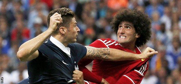 Manchester United forward Marouane Fellaini provides a physical challenge to Belgium's opponents