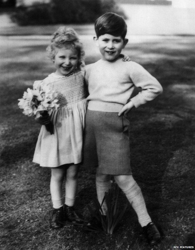 Princess Anne (3) with her brother Prince Charles, (5) in the garden of the Royal Lodge at Windsor, 1954