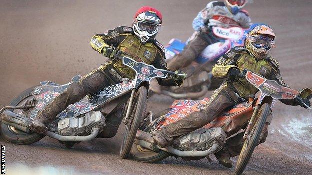 Coventry's Jason Garrity and Poole's Stuart Robson tangled in heat nine in the slippery conditions at Brandon.