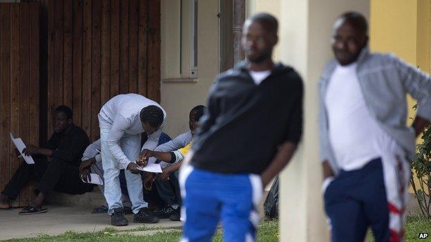 Migrants at a processing centre in Sicily