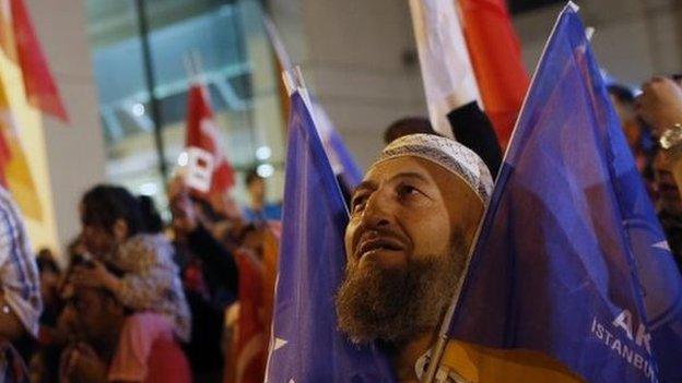 Supporters of Turkey"s ruling Justice and Development Party gather after the election results came out in Istanbul, Turkey, late Sunday, June 7, 2015.