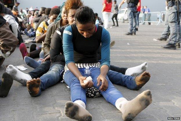 Migrants after disembarking from the Royal Navy ship HMS Bulwark