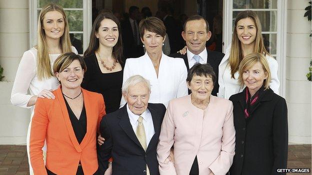 Tony Abbott poses with his family after being sworn in as the 28th Prime Minister of Australia in 2013 in Canberra, Australia