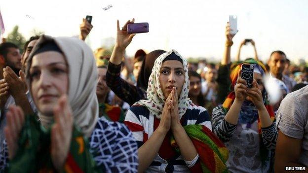 Supporters of the Pro-Kurdish Peoples' Democratic Party (HDP) react during a gathering to celebrate their party's victory during the parliamentary election, in Diyarbakir, Turkey, 8 June 2015.