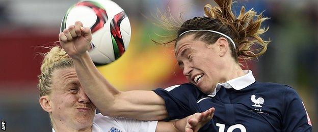 England defender Laura Bassett (L) vies with France midfielder Camille Abily