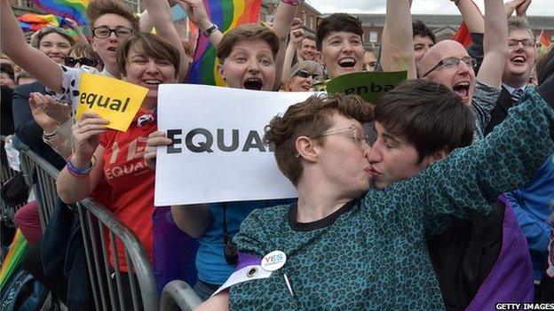 A gay couple kiss in Dublin Castle Square as the result of the referendum is relayed on May 23, 2015 in Dublin, Ireland