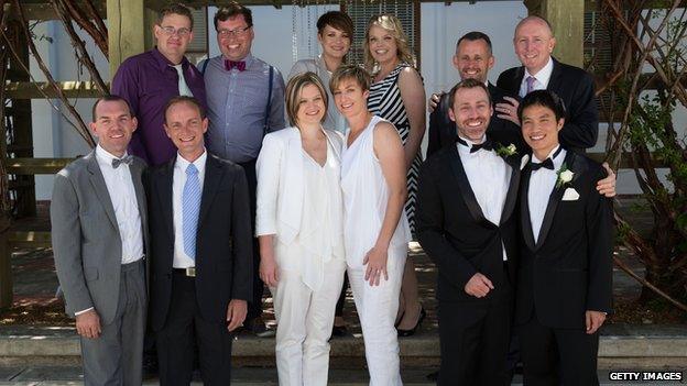 Newly married gay and lesbian couples pose for a photograph at Canberra's Old Parliament House, December 2013.